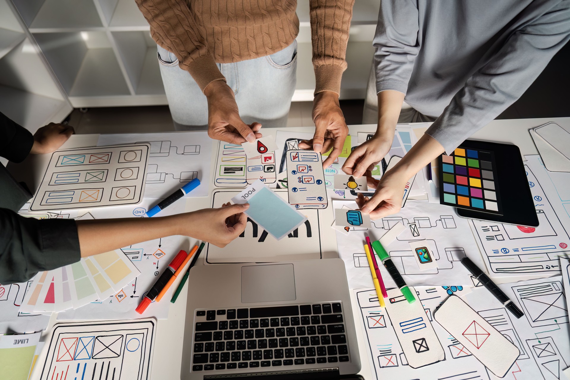 Creative UX/UI Design Brainstorming Session with Diverse Team Collaborating on Innovative Digital Interface Concepts